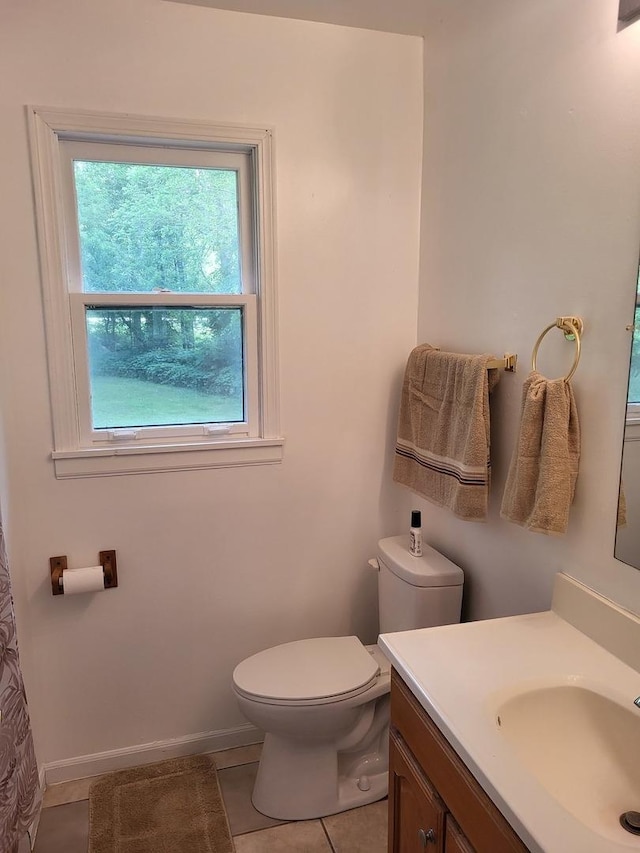 2820 S Brooks Island Rd, Oregon, IL 61061 - bathroom with healthy amount of natural light, vanity, toilet, and tile patterned floors