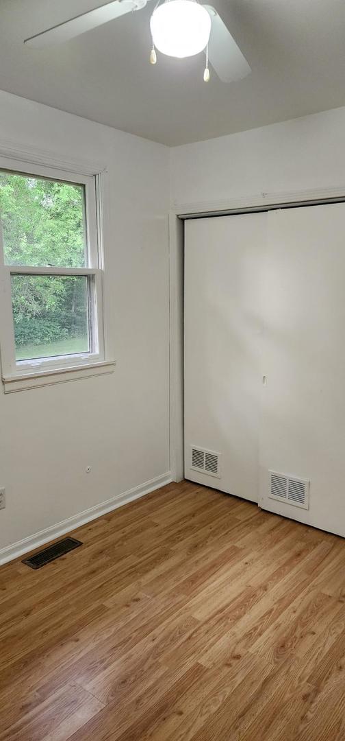 2820 S Brooks Island Rd, Oregon, IL 61061 - unfurnished room featuring light wood-type flooring and a ceiling fan