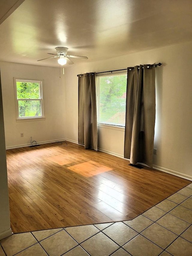 2820 S Brooks Island Rd, Oregon, IL 61061 - unfurnished room with wood finished floors, a ceiling fan, and baseboards