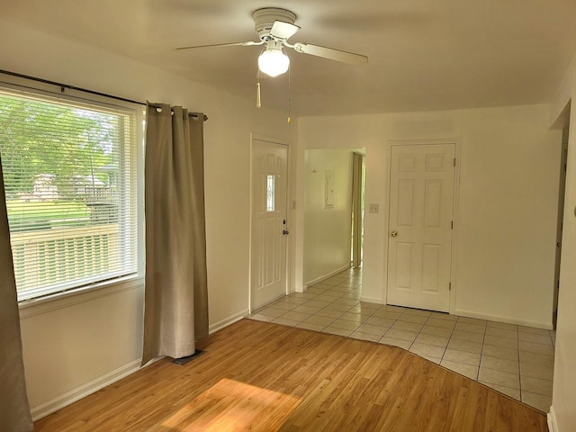2820 S Brooks Island Rd, Oregon, IL 61061 - empty room featuring ceiling fan, light tile patterned flooring, and baseboards