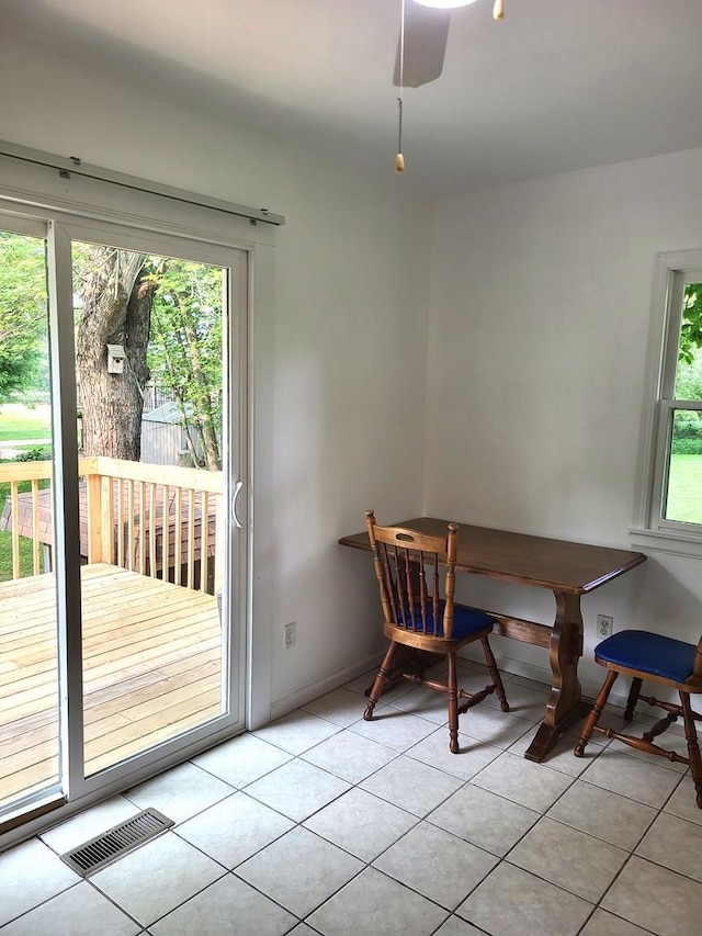 2820 S Brooks Island Rd, Oregon, IL 61061 - dining space featuring light tile patterned floors and baseboards