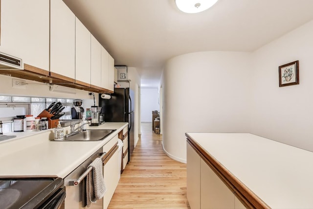 900 W Ainslie St Unit A, Chicago, IL 60640 - kitchen with light wood finished floors, light countertops, white cabinetry, freestanding refrigerator, and dishwasher