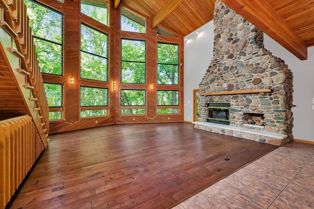 3085 W Southmor Rd, Morris, IL 60450 - unfurnished living room featuring a wooden ceiling with exposed beams, a stone fireplace, radiator, high vaulted ceiling, and wood finished floors