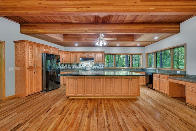 3085 W Southmor Rd, Morris, IL 60450 - kitchen with black appliances, light wood finished floors, under cabinet range hood, a wooden ceiling with exposed beams, and healthy amount of natural light