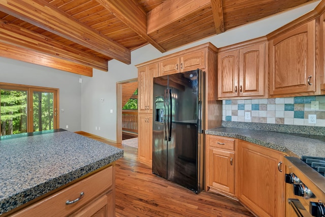 3085 W Southmor Rd, Morris, IL 60450 - kitchen with black fridge, a wooden ceiling with exposed beams, backsplash, light wood-type flooring, and stainless steel gas cooktop