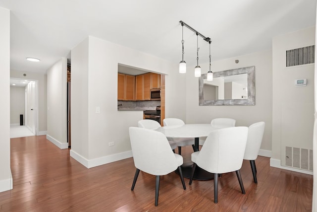 440 N Mcclurg Ct Unit 301, Chicago, IL 60611 - dining area with wood finished floors and baseboards