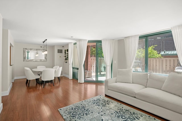 440 N Mcclurg Ct Unit 301, Chicago, IL 60611 - living area with baseboards, plenty of natural light, and wood finished floors