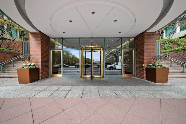 440 N Mcclurg Ct Unit 301, Chicago, IL 60611 - view of exterior entry featuring brick siding and a carport