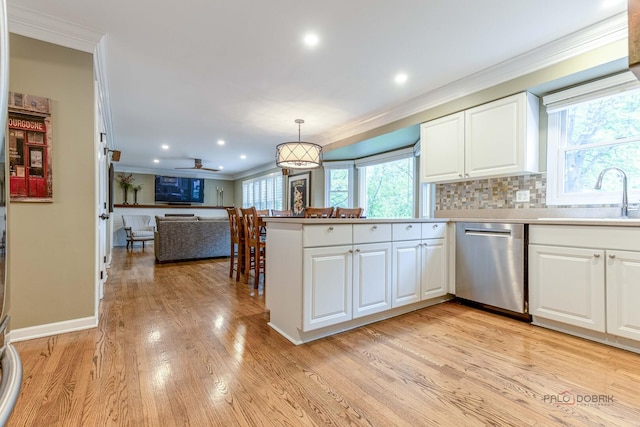 605 E Golf Rd, Libertyville, IL 60048 - kitchen featuring stainless steel dishwasher, a sink, crown molding, white cabinets, and light wood finished floors