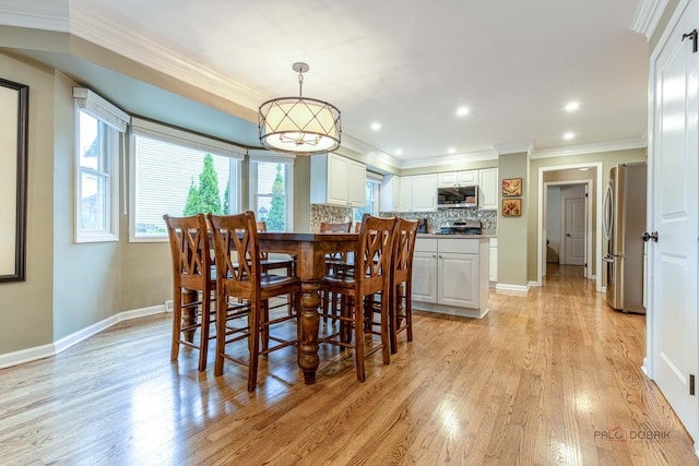 605 E Golf Rd, Libertyville, IL 60048 - dining space with crown molding, light wood-style flooring, and baseboards