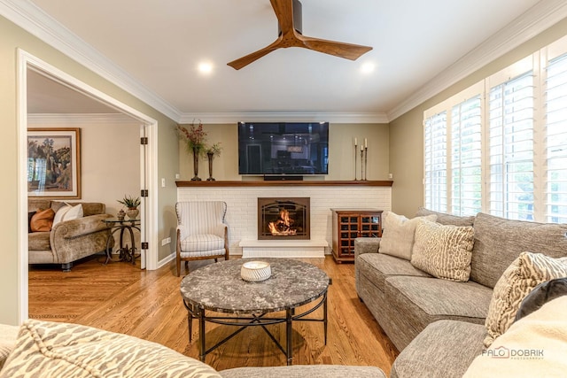 605 E Golf Rd, Libertyville, IL 60048 - living room featuring a ceiling fan, wood finished floors, ornamental molding, a brick fireplace, and baseboards