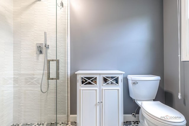 605 E Golf Rd, Libertyville, IL 60048 - bathroom with a tile shower, toilet, baseboards, and tile patterned floors