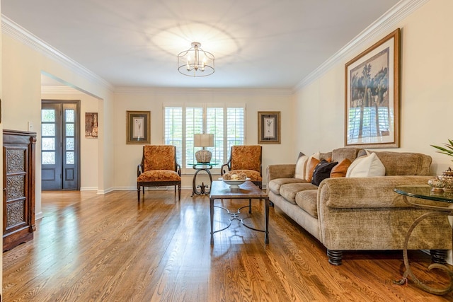 605 E Golf Rd, Libertyville, IL 60048 - living room with crown molding, wood finished floors, a chandelier, and baseboards