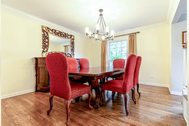 605 E Golf Rd, Libertyville, IL 60048 - dining area featuring a chandelier, wood finished floors, ornamental molding, and baseboards