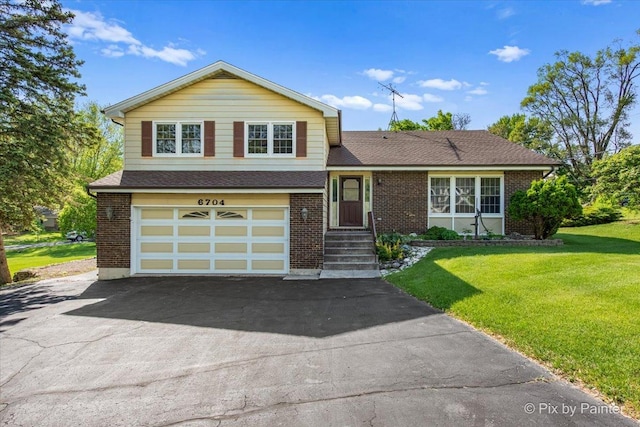 6704 Cypress Ct, Crystal Lake, IL 60012 - split level home featuring driveway, a front lawn, brick siding, and roof with shingles