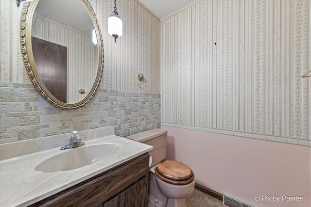 6704 Cypress Ct, Crystal Lake, IL 60012 - bathroom with wallpapered walls, toilet, and vanity