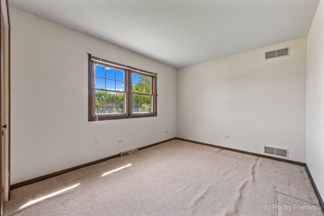 6704 Cypress Ct, Crystal Lake, IL 60012 - spare room featuring carpet flooring and baseboards