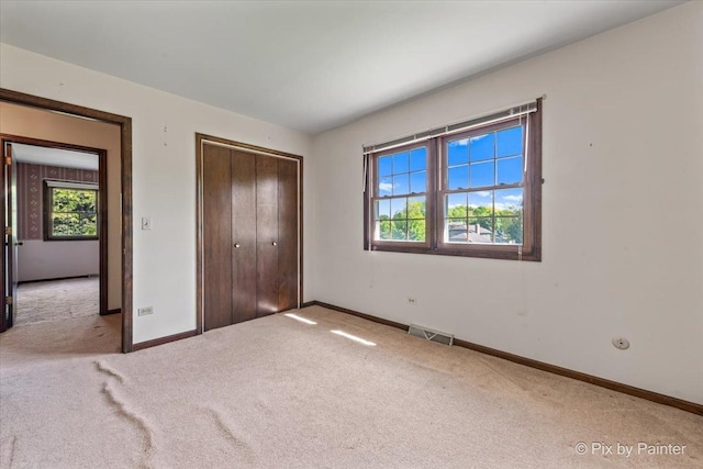 6704 Cypress Ct, Crystal Lake, IL 60012 - unfurnished bedroom with carpet flooring, baseboards, and a closet