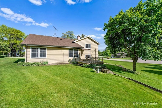 6704 Cypress Ct, Crystal Lake, IL 60012 - rear view of house with a wooden deck, a lawn, a chimney, and a shingled roof
