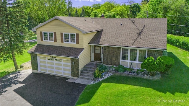 6704 Cypress Ct, Crystal Lake, IL 60012 - split level home with asphalt driveway, roof with shingles, a chimney, and a front yard