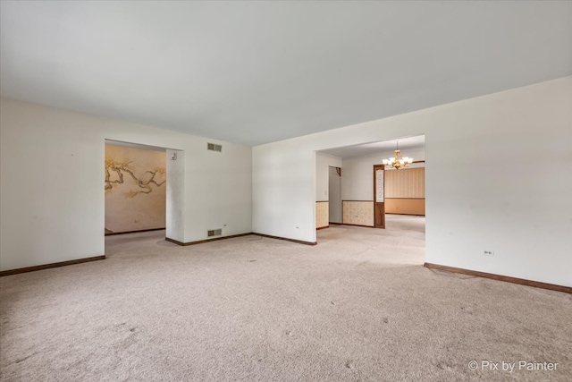 6704 Cypress Ct, Crystal Lake, IL 60012 - carpeted spare room with a chandelier and baseboards