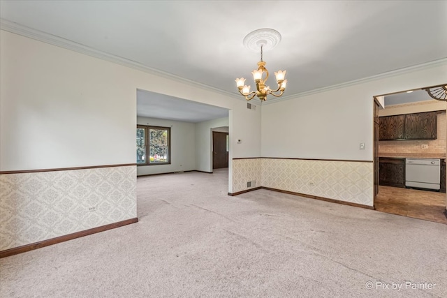6704 Cypress Ct, Crystal Lake, IL 60012 - carpeted empty room featuring crown molding, a chandelier, wainscoting, and baseboards