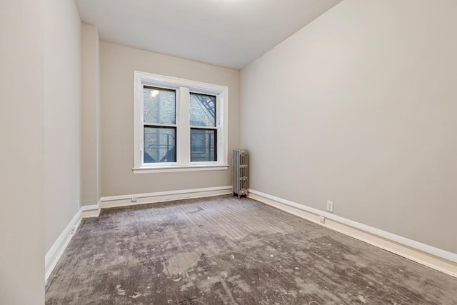 6801 S Crandon Ave Unit 1, Chicago, IL 60649 - spare room featuring radiator heating unit and baseboards