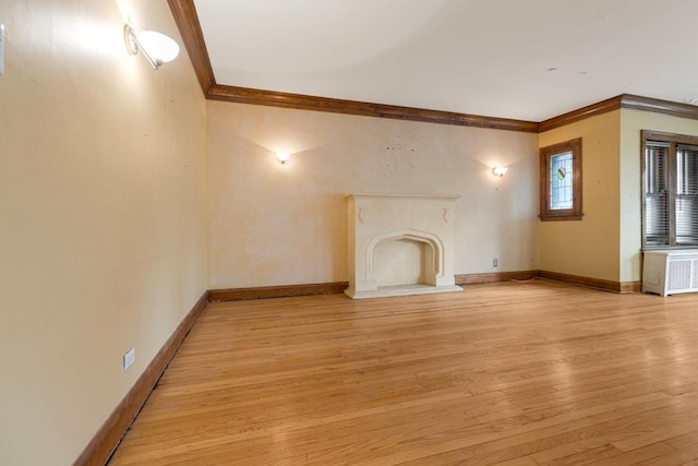 6801 S Crandon Ave Unit 1, Chicago, IL 60649 - unfurnished living room featuring ornamental molding, light wood-style floors, and baseboards