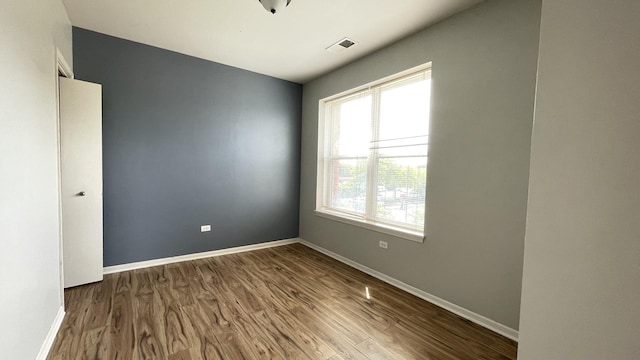 3522 S State St Unit 301, Chicago, IL 60609 - unfurnished room featuring wood finished floors and baseboards