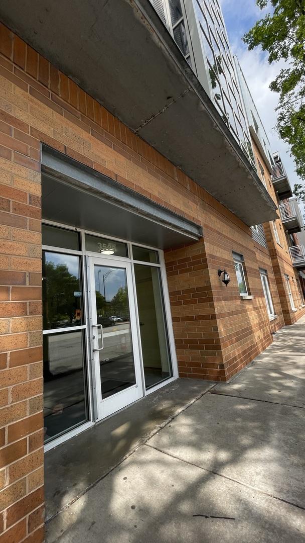 3522 S State St Unit 301, Chicago, IL 60609 - view of property exterior featuring brick siding and a patio