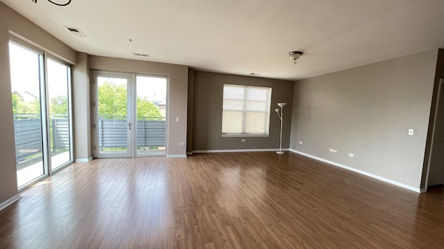 3522 S State St Unit 301, Chicago, IL 60609 - empty room featuring baseboards and wood finished floors