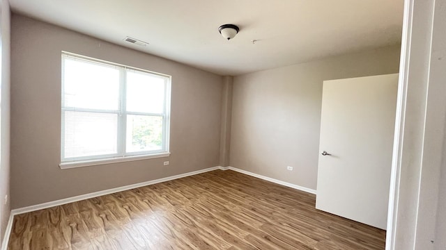3522 S State St Unit 301, Chicago, IL 60609 - spare room featuring wood finished floors and baseboards