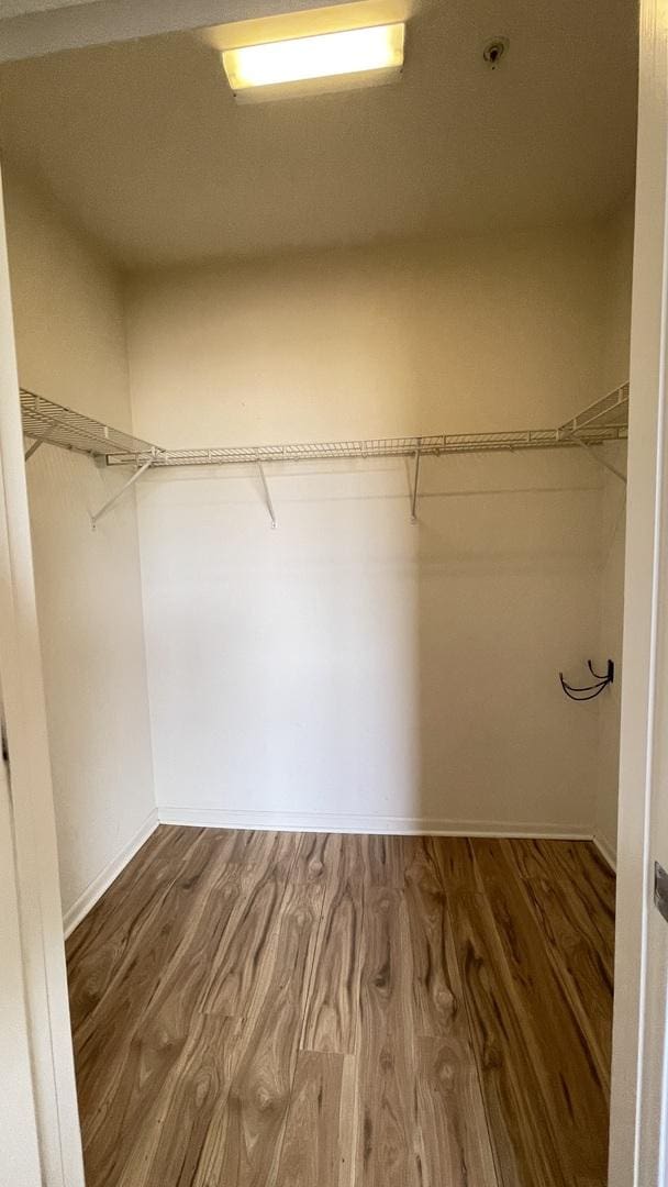 3522 S State St Unit 301, Chicago, IL 60609 - walk in closet featuring wood finished floors