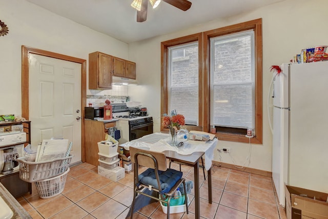 3342 S Aberdeen St, Chicago, IL 60608 - kitchen with white appliances, ceiling fan, light tile patterned flooring, decorative backsplash, and brown cabinets