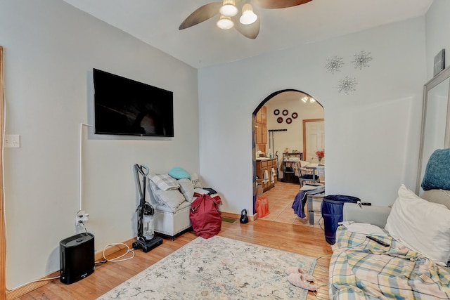 3342 S Aberdeen St, Chicago, IL 60608 - living area featuring arched walkways, a ceiling fan, and light wood finished floors