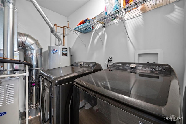 8523 Stillwater Rd, Wonder Lake, IL 60097 - laundry room featuring washer and dryer and water heater