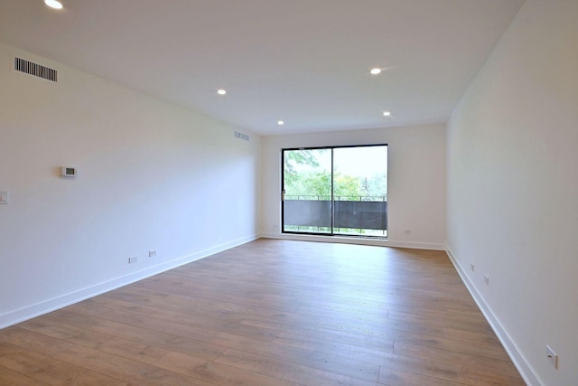 700 Wellington Ave Unit 315, Elk Grove Village, IL 60007 - unfurnished room featuring wood-type flooring, baseboards, and recessed lighting