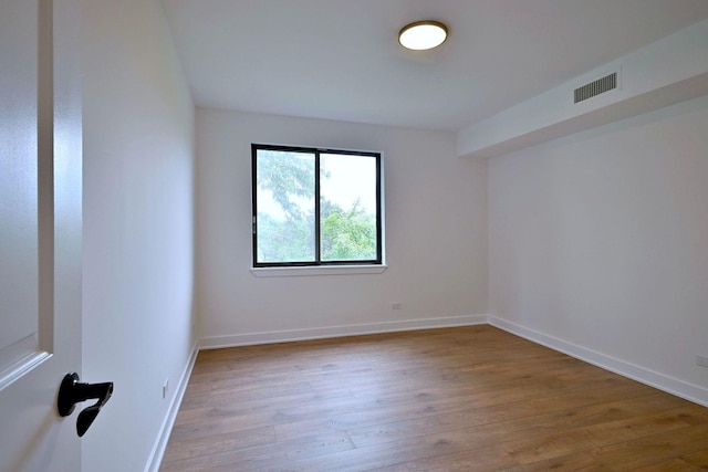 700 Wellington Ave Unit 315, Elk Grove Village, IL 60007 - unfurnished room featuring hardwood / wood-style floors and baseboards