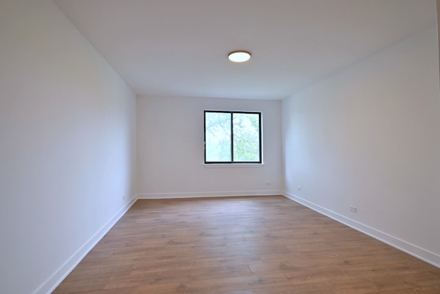 700 Wellington Ave Unit 315, Elk Grove Village, IL 60007 - empty room featuring wood finished floors and baseboards