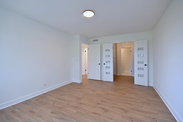 700 Wellington Ave Unit 315, Elk Grove Village, IL 60007 - unfurnished bedroom featuring light wood finished floors and baseboards