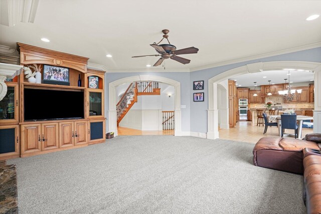 24355 S Arranmore Way, Frankfort, IL 60423 - living area with light colored carpet, arched walkways, recessed lighting, ornamental molding, and ceiling fan