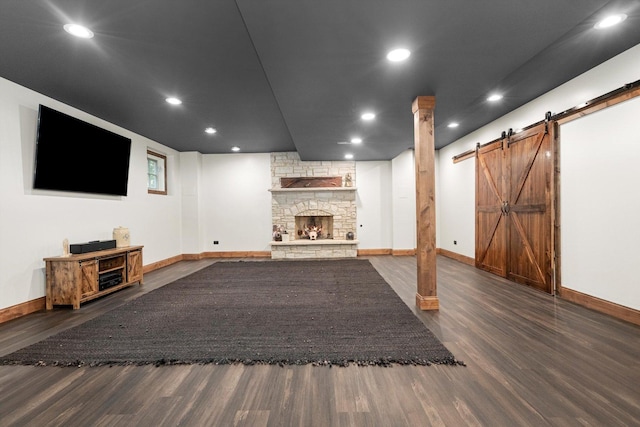 24355 S Arranmore Way, Frankfort, IL 60423 - unfurnished living room featuring a fireplace, wood finished floors, baseboards, a barn door, and recessed lighting