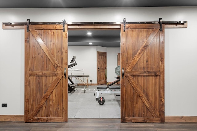 24355 S Arranmore Way, Frankfort, IL 60423 - exercise room with a barn door, wood finished floors, and recessed lighting