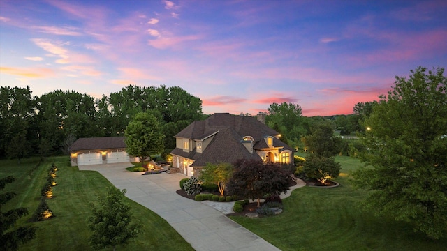 24355 S Arranmore Way, Frankfort, IL 60423 - french provincial home with a front yard, concrete driveway, an outbuilding, a chimney, and a detached garage