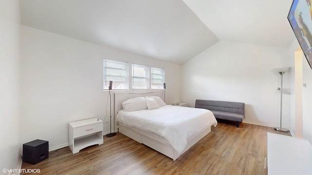18153 Idlewild Dr, Country Club Hills, IL 60478 - bedroom featuring light wood-type flooring, lofted ceiling, and baseboards