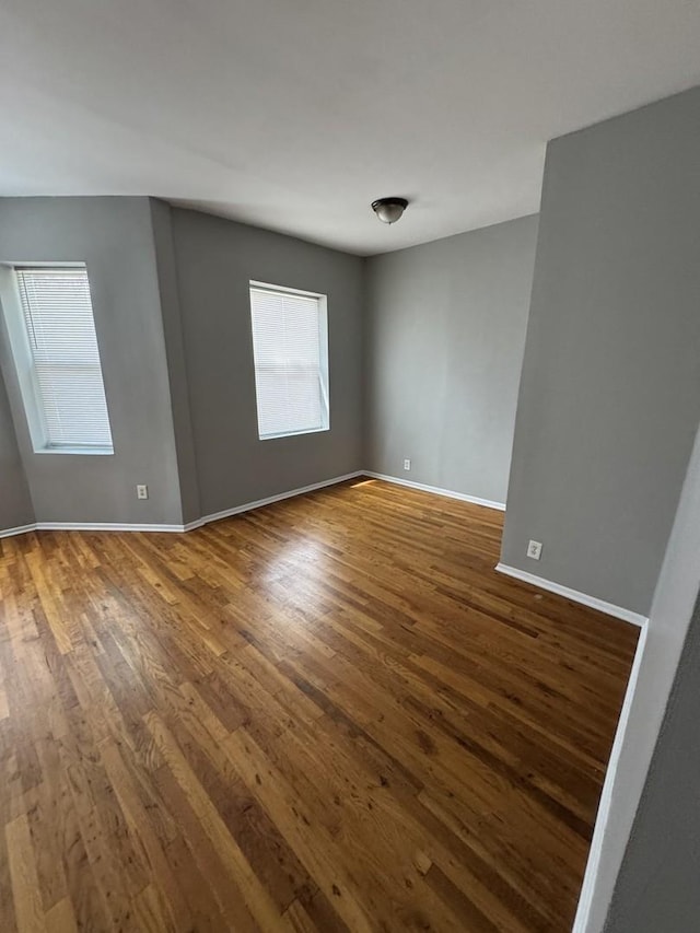 3926 W Flournoy St, Chicago, IL 60624 - unfurnished room with dark wood-style flooring and baseboards