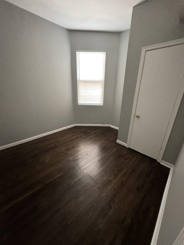 3926 W Flournoy St, Chicago, IL 60624 - unfurnished room featuring dark wood-type flooring and baseboards