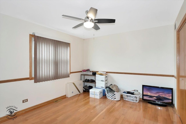 2985 Royal Ct, New Lenox, IL 60451 - empty room with wood finished floors, a ceiling fan, and baseboards