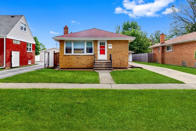521 Buckthorn Ln, Hillside, IL 60162 - bungalow-style home with entry steps, a chimney, and brick siding