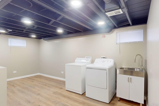 521 Buckthorn Ln, Hillside, IL 60162 - laundry area with separate washer and dryer, light wood finished floors, and baseboards